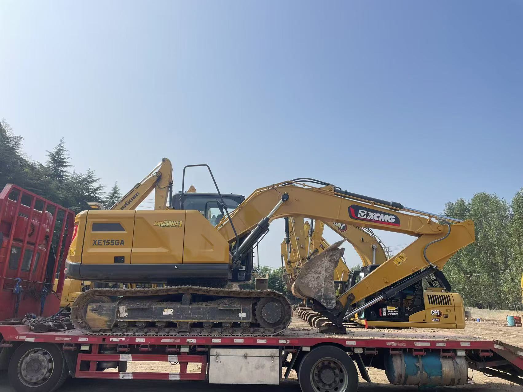 XCMG crawler excavator prepared on a low-bed trailer before the port leg.