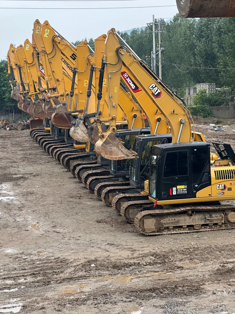 Caterpillar XCMG and LiuGong excavators lined up in the yard
